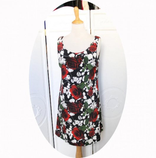 Robe courte trapeze sans manches en crepe de soie noire imprimee roses rouges et feuilles blanches