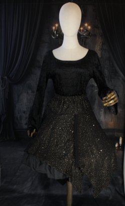 Jupe mi-longue en maille noire et dorée
